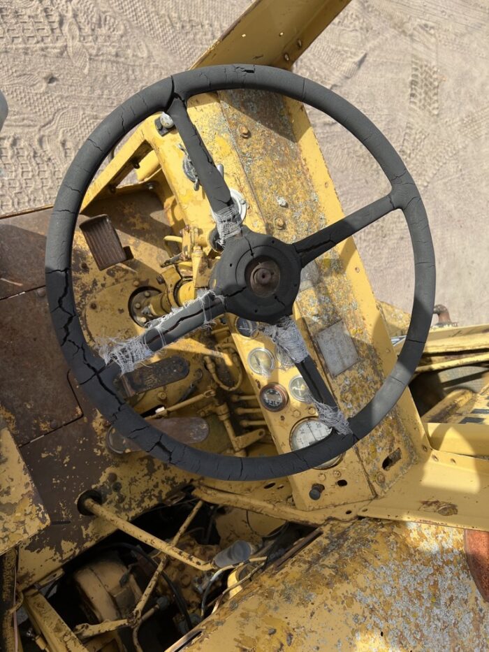 Steering wheel for a machine